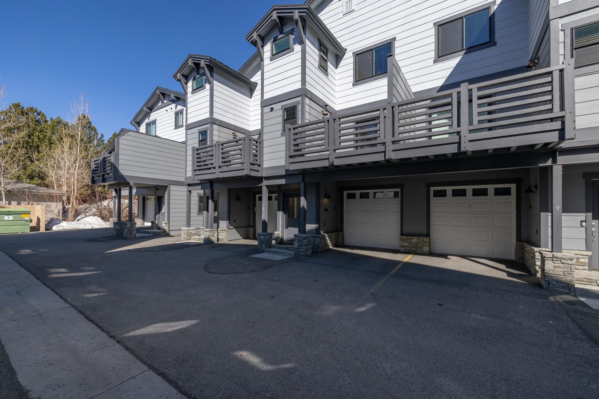 28 Oak Tree Way, Unit 8 Mammoth Lakes, CA 93546 - Photo 32 of 32 View of property with an attached garage and driveway
