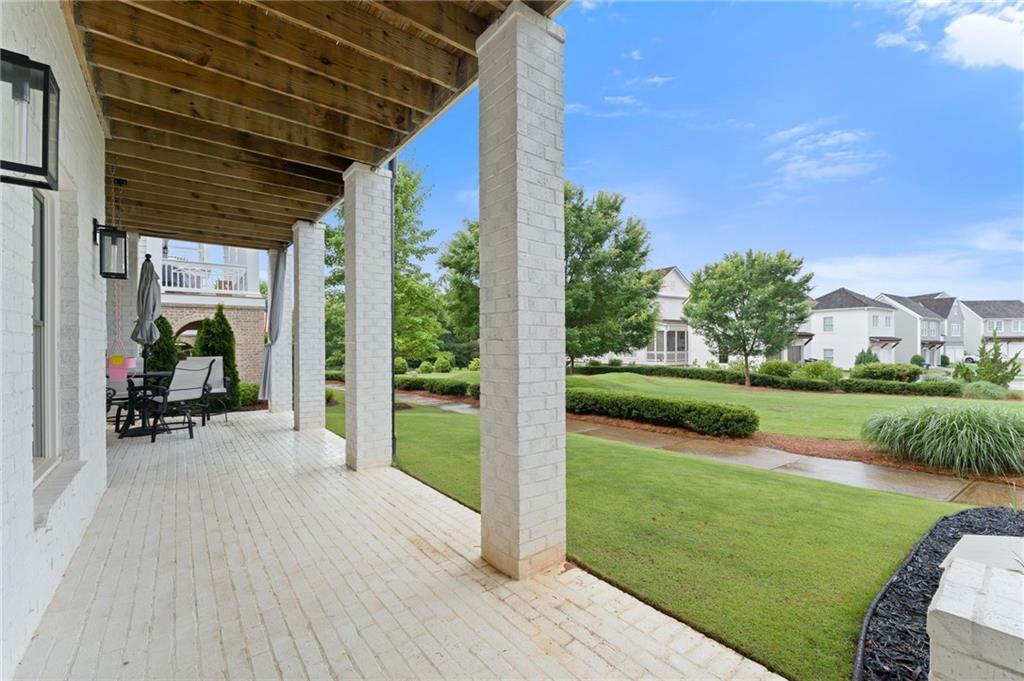 7170 Lullwater Road Cumming, GA 30040 - Photo 75 of 86 a view of a porch and garden
