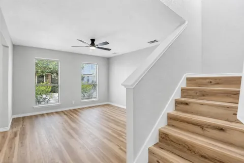 a view of an entryway with wooden floor and a window