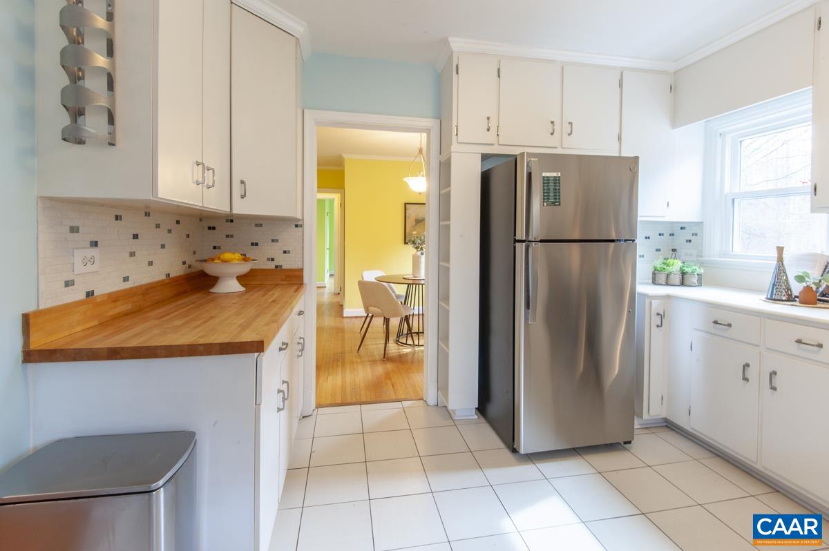 1606 Grove Road Charlottesville, VA 22901 - Photo 13 of 52 a kitchen with stainless steel appliances a refrigerator sink and cabinets