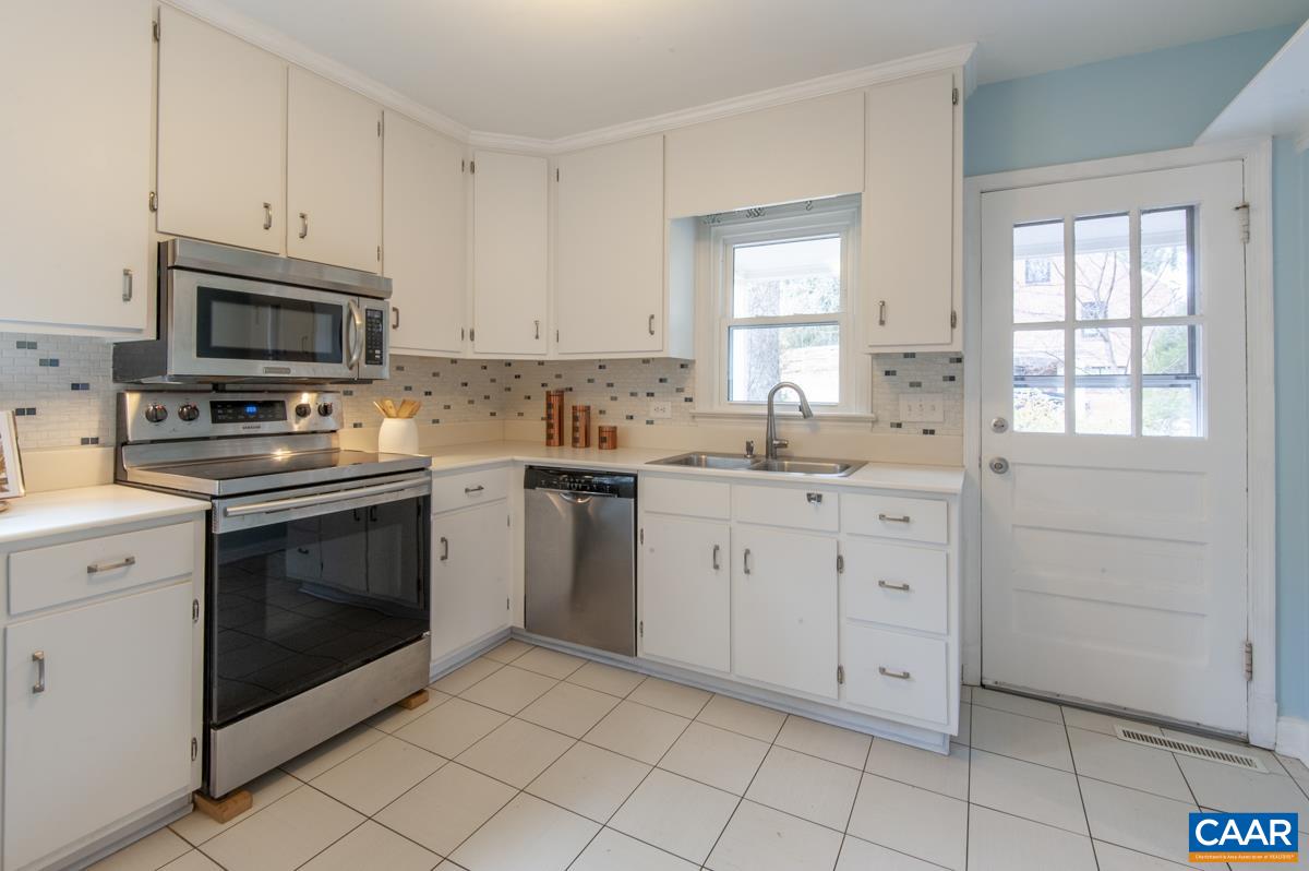 1606 Grove Road Charlottesville, VA 22901 - Photo 14 of 52 a kitchen with white cabinets appliances and sink