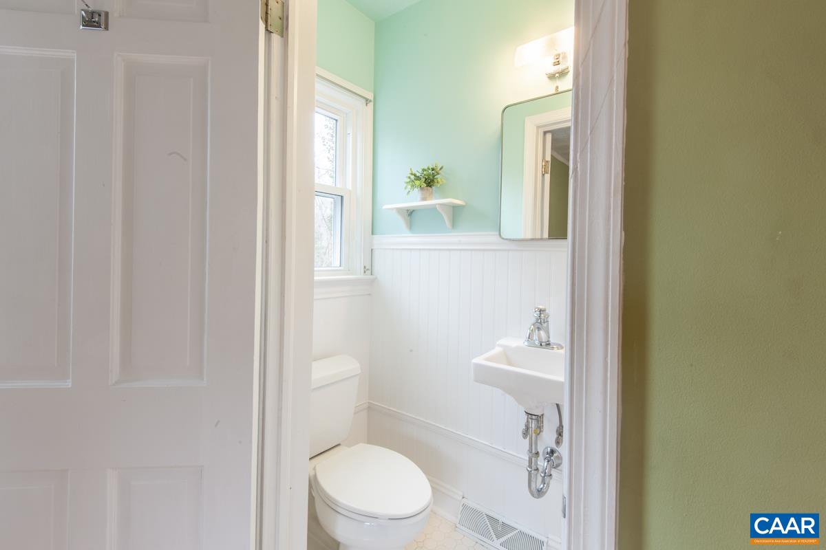 1606 Grove Road Charlottesville, VA 22901 - Photo 20 of 52 a white toilet sitting next to a bathroom sink