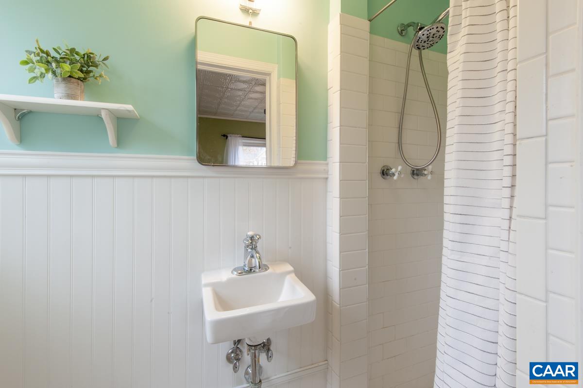 1606 Grove Road Charlottesville, VA 22901 - Photo 21 of 52 a bathroom with a sink and mirror