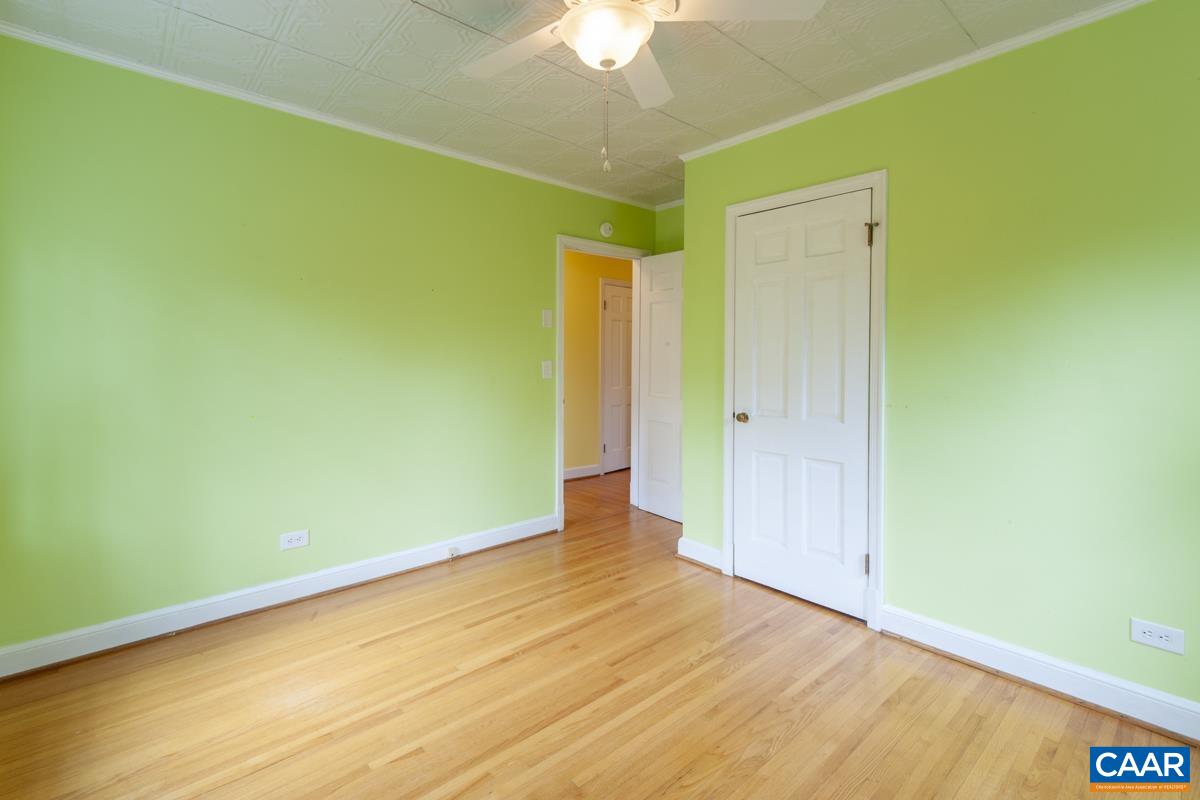 1606 Grove Road Charlottesville, VA 22901 - Photo 25 of 52 a view of an empty room with wooden floor and a window
