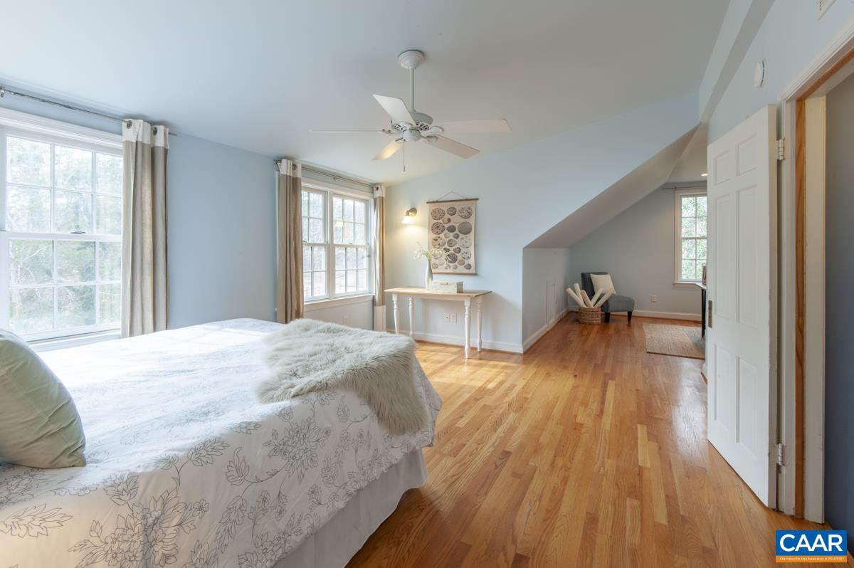 1606 Grove Road Charlottesville, VA 22901 - Photo 28 of 52 a spacious bedroom with a bed and a large window with wooden floor