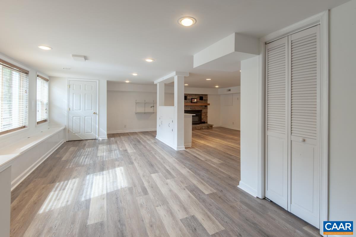 1606 Grove Road Charlottesville, VA 22901 - Photo 35 of 52 an empty room with wooden floor and windows
