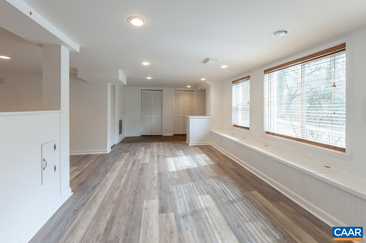 1606 Grove Road Charlottesville, VA 22901 - Photo 36 of 52 a view of an empty room with wooden floor and a window