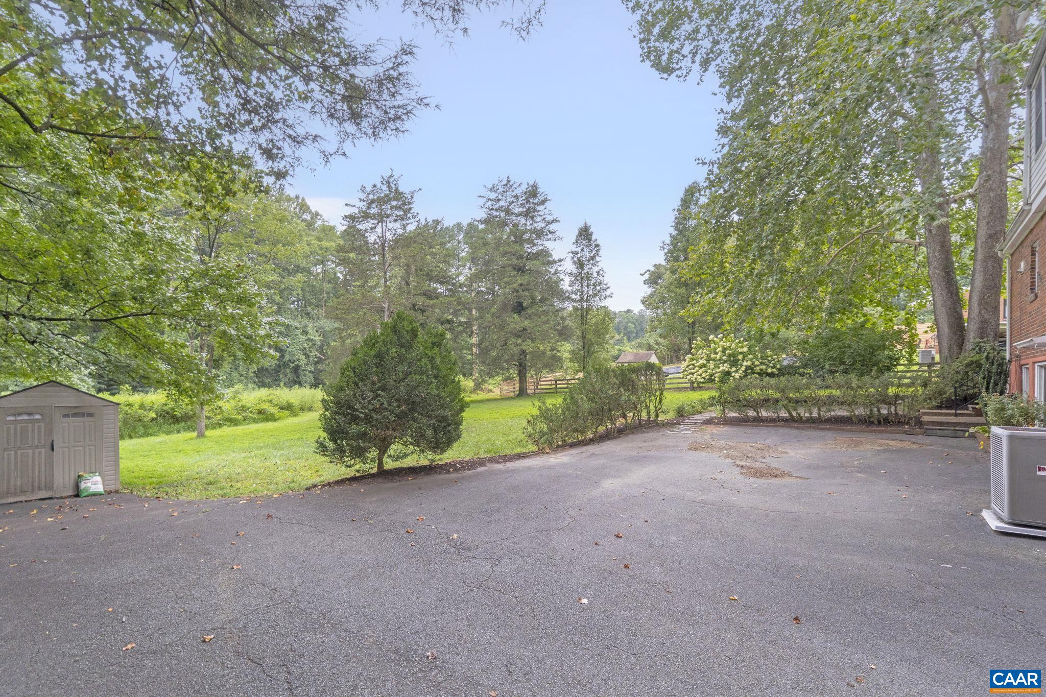 1606 Grove Road Charlottesville, VA 22901 - Photo 46 of 52 a view of a yard with plants and trees