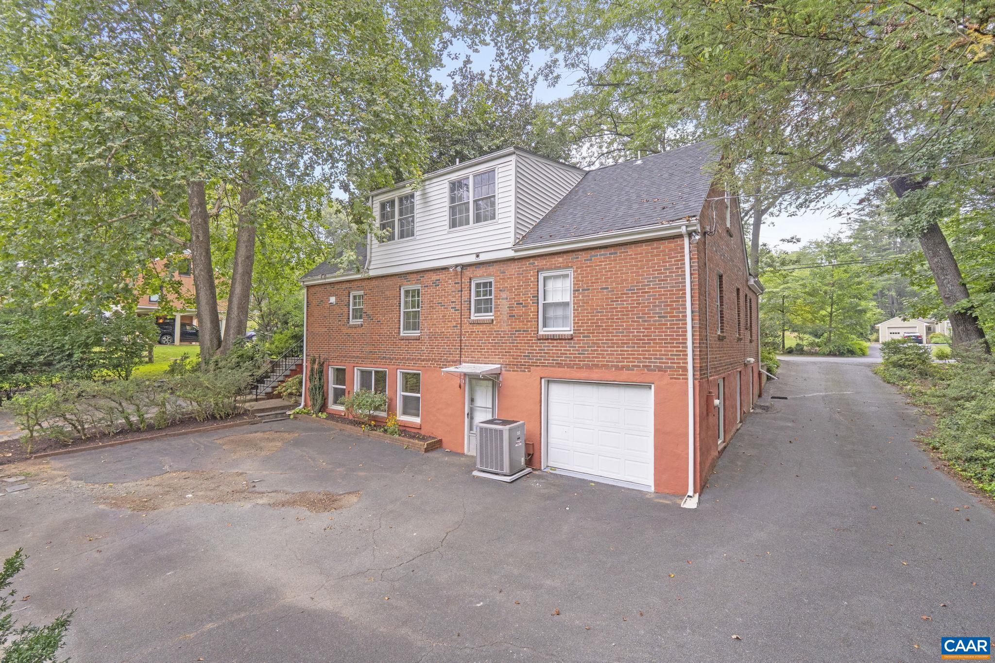 1606 Grove Road Charlottesville, VA 22901 - Photo 50 of 52 a view of a house with a yard and garage