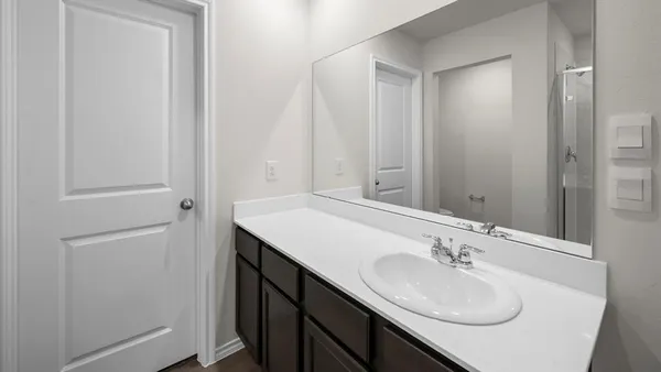 a kitchen with stainless steel appliances a refrigerator and a stove top oven