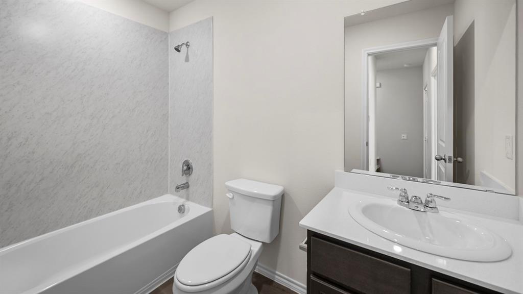 1913 Freeman Street Tyler, TX 75704 - Photo 14 of 21 Full bathroom with vanity and shower / washtub combination
