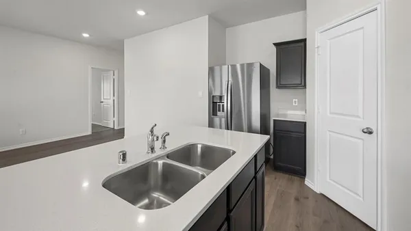 a kitchen with a stove and a microwave