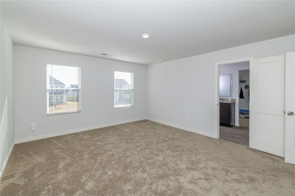 244 Overlook Road Covington, GA 30014 - Photo 11 of 24 an empty room with windows