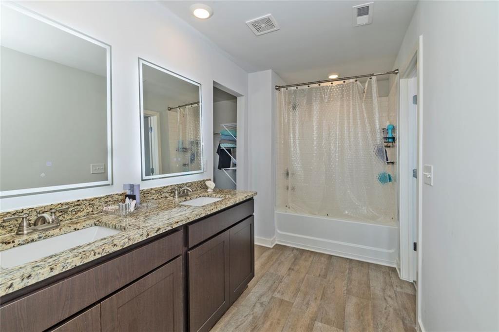 244 Overlook Road Covington, GA 30014 - Photo 13 of 24 a bathroom with a granite countertop sink and a mirror