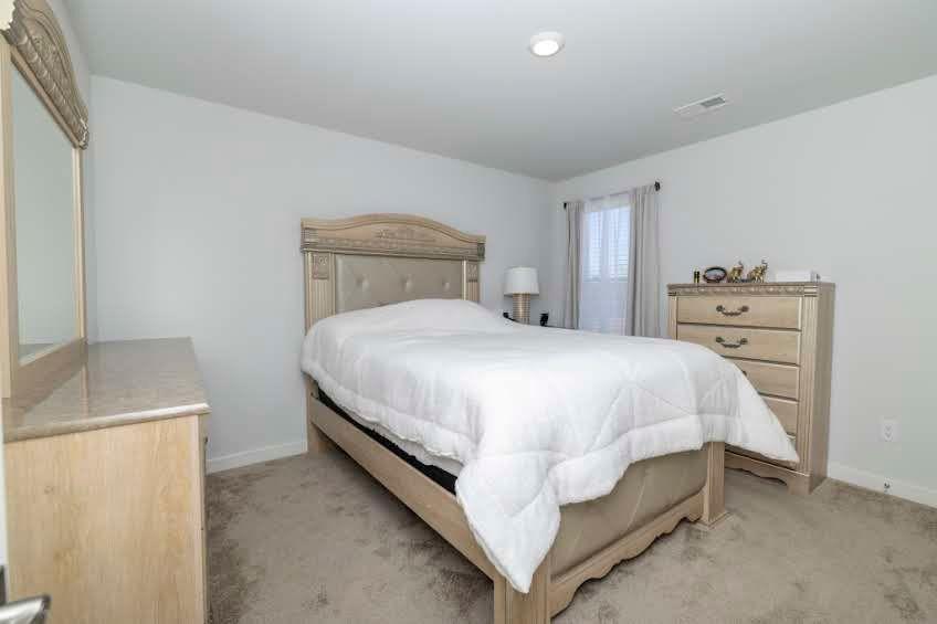 244 Overlook Road Covington, GA 30014 - Photo 18 of 24 a bedroom with a bed and a sink