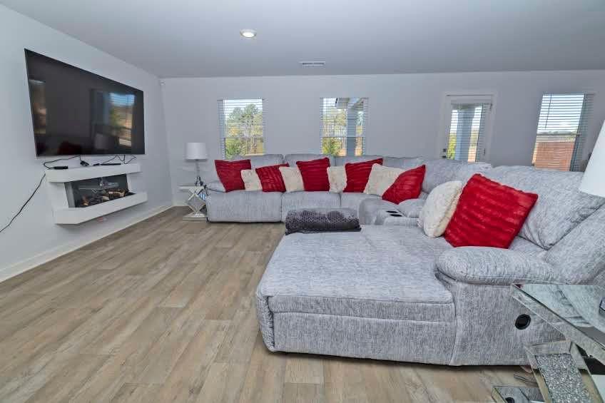 244 Overlook Road Covington, GA 30014 - Photo 4 of 24 a living room with furniture and a flat screen tv