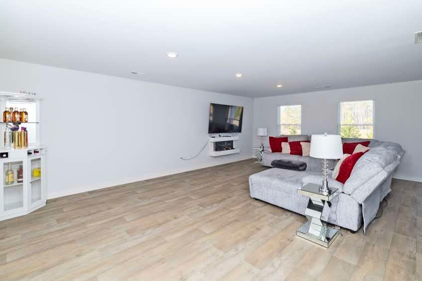 244 Overlook Road Covington, GA 30014 - Photo 5 of 24 a living room with furniture and a flat screen tv