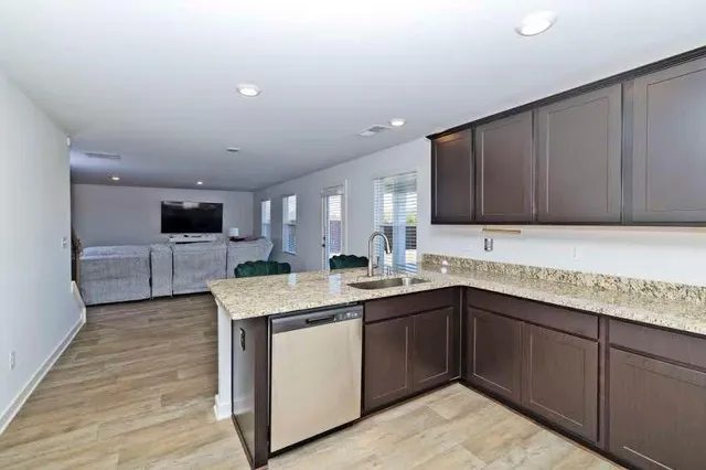 a kitchen with a sink and cabinets