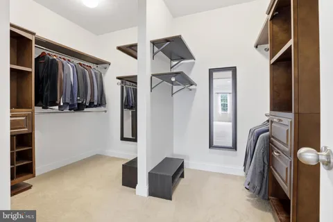 a view of a livingroom with a furniture and a ceiling fan
