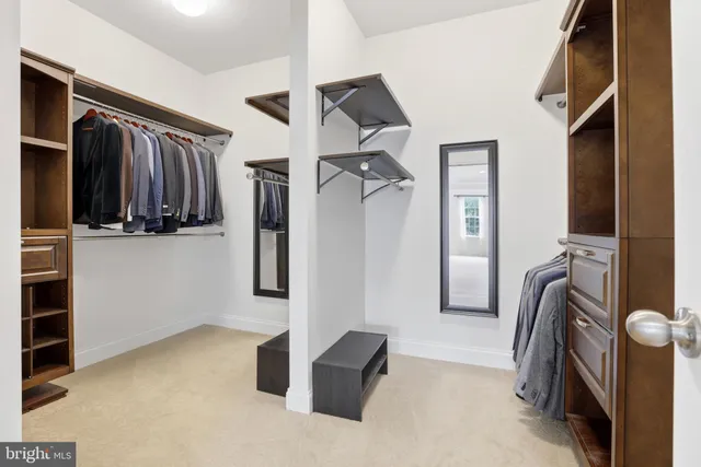 a view of a livingroom with a furniture and a ceiling fan