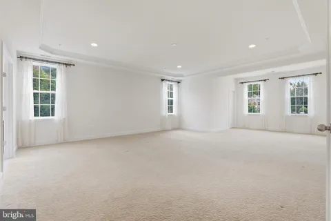 a bathroom with a granite countertop sink mirror and shower