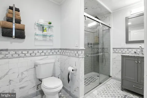 a view of a patio with couches table and chairs and potted plants