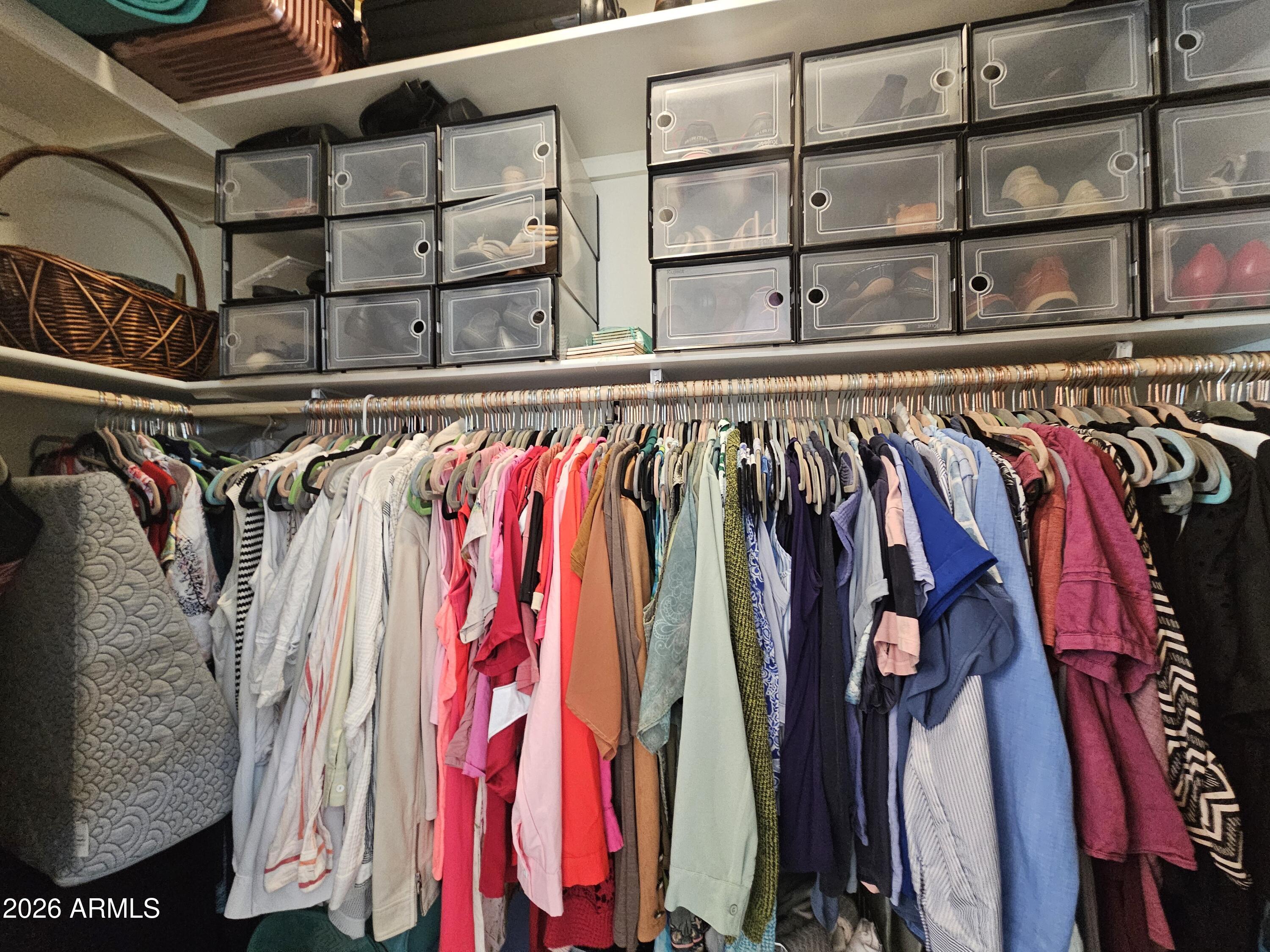 650 North Hawes Road, Unit 3331 Mesa, AZ 85207 - Photo 22 of 38 a view of walk in closet with clothes and shoes
