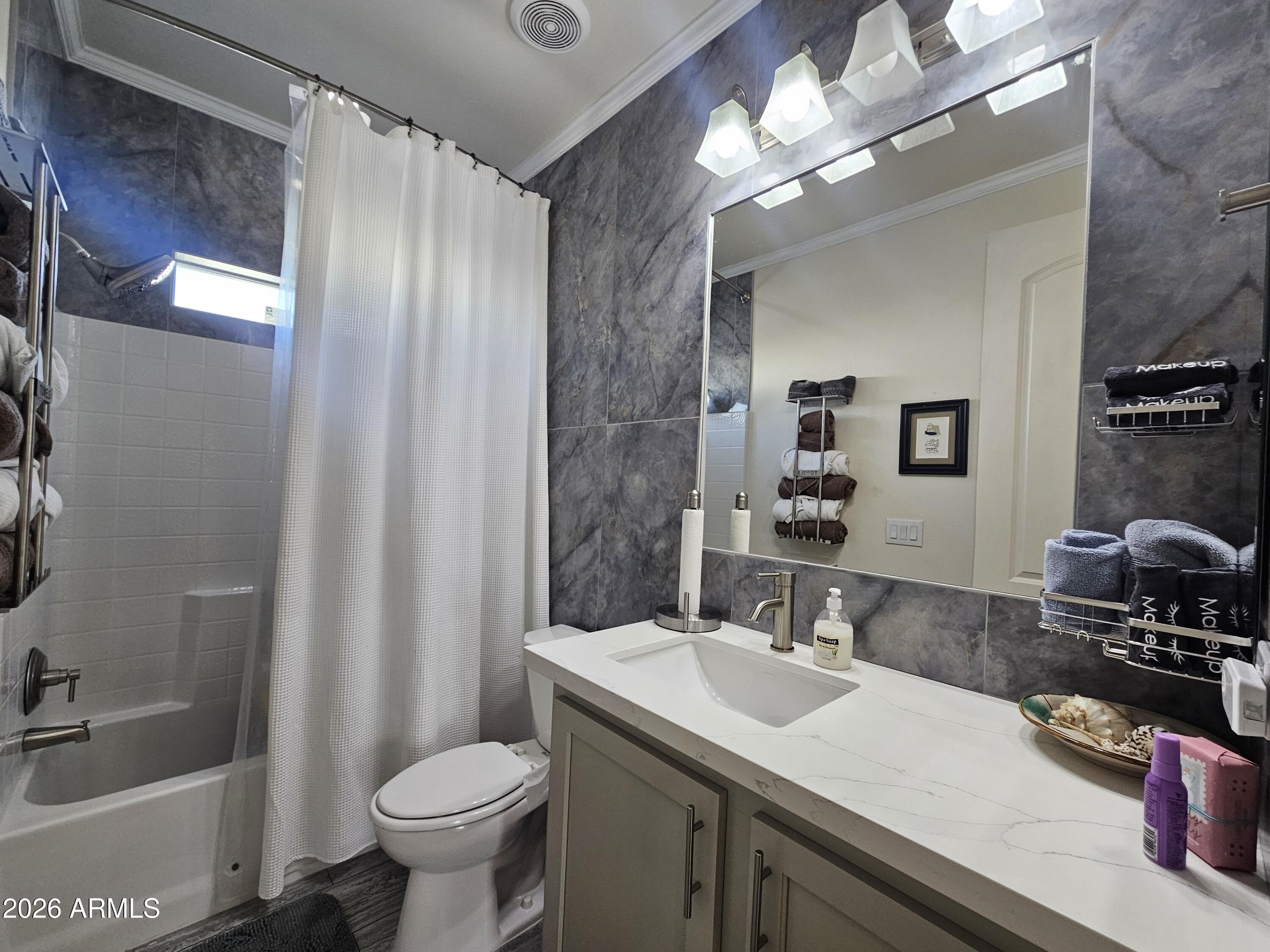 650 North Hawes Road, Unit 3331 Mesa, AZ 85207 - Photo 4 of 38 a bathroom with a granite countertop sink toilet and shower