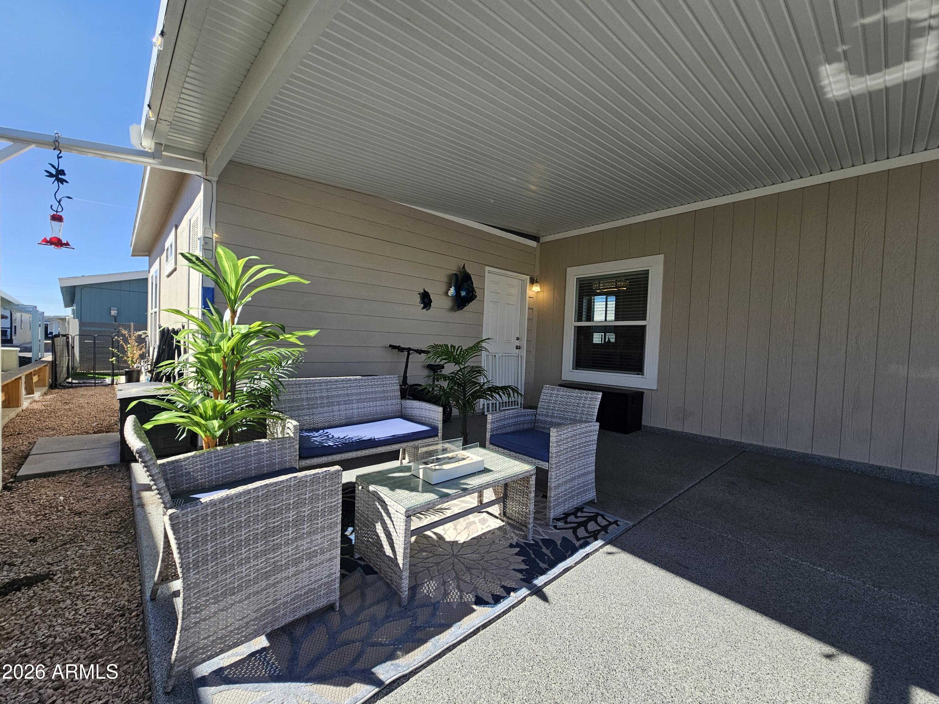 650 North Hawes Road, Unit 3331 Mesa, AZ 85207 - Photo 8 of 38 a living room with furniture and a potted plant