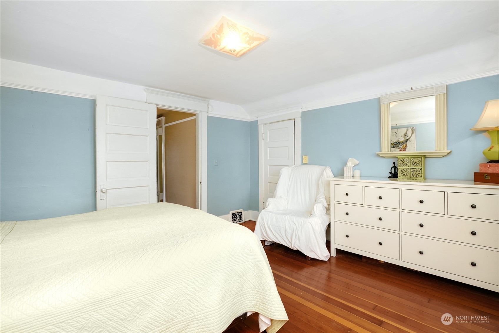 309 North 73rd Street Seattle, WA 98103 - Photo 11 of 30 a bedroom with a bed and a dresser