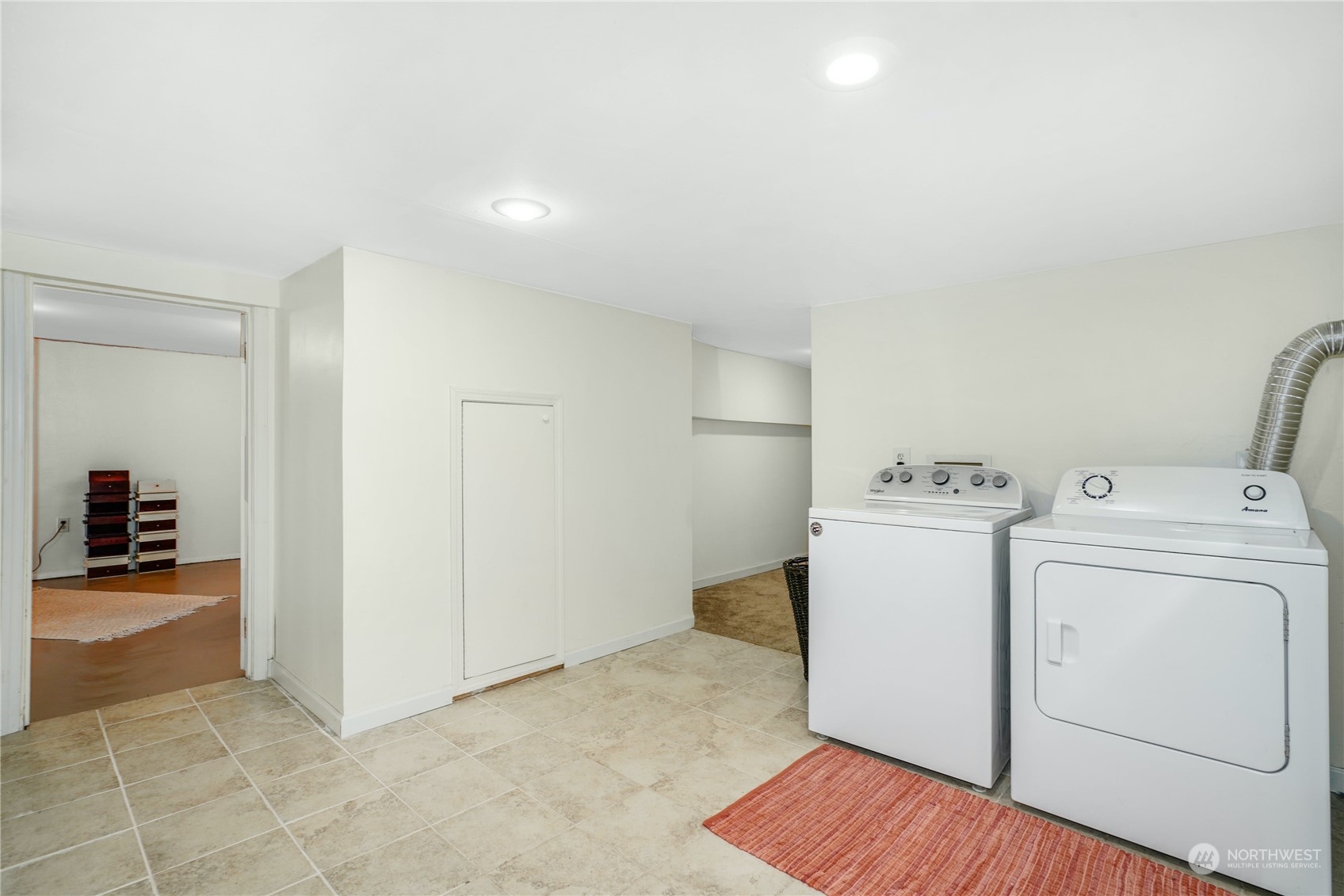 309 North 73rd Street Seattle, WA 98103 - Photo 22 of 30 a view of storage and utility room with washer and dryer