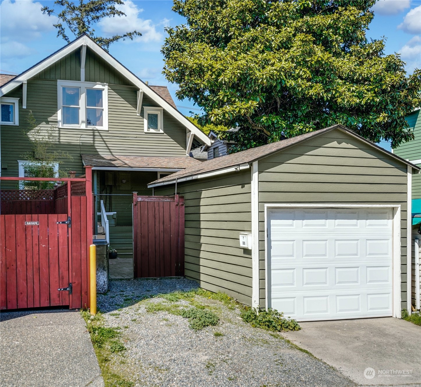 309 North 73rd Street Seattle, WA 98103 - Photo 25 of 30 a view of a house with a garage