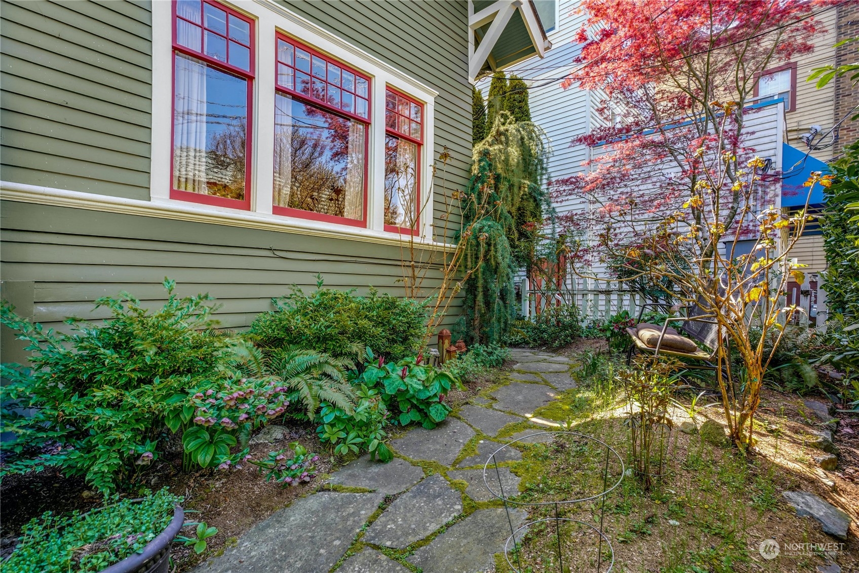 309 North 73rd Street Seattle, WA 98103 - Photo 26 of 30 a view of a brick house with a yard