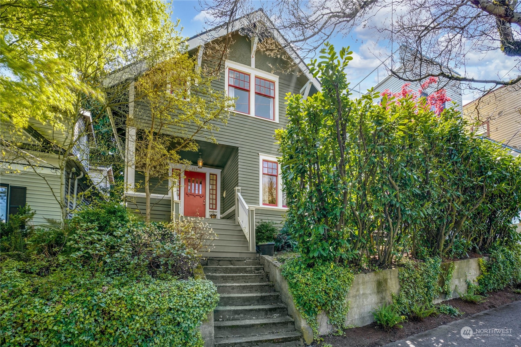 309 North 73rd Street Seattle, WA 98103 - Photo 27 of 30 a front view of a house with plants