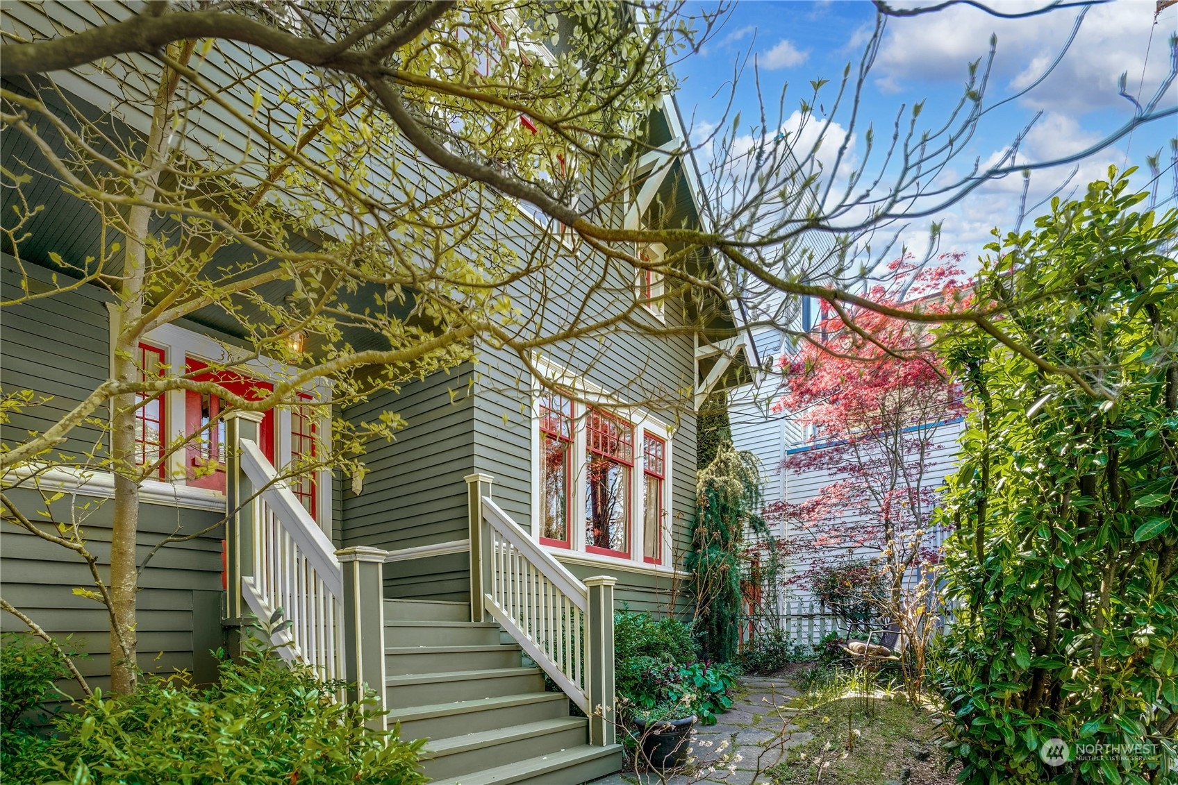 309 North 73rd Street Seattle, WA 98103 - Photo 30 of 30 a view of a building with a tree