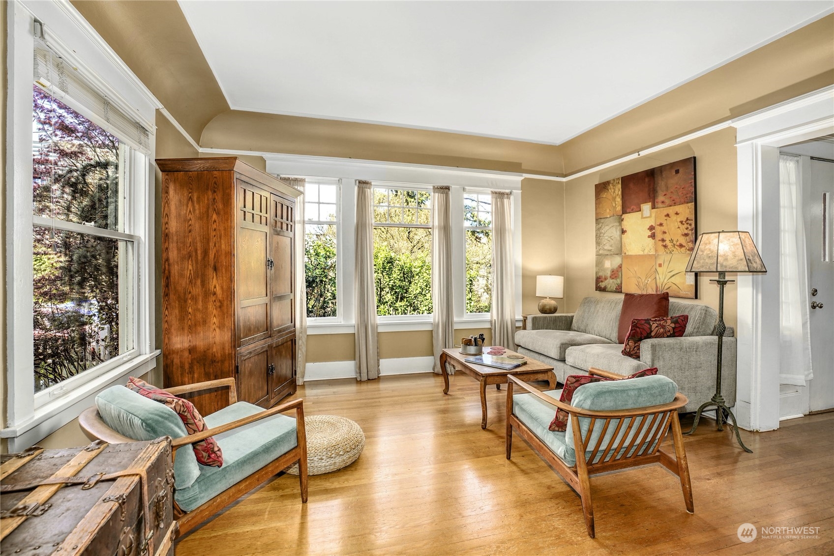 309 North 73rd Street Seattle, WA 98103 - Photo 4 of 30 a living room with furniture and a floor to ceiling window