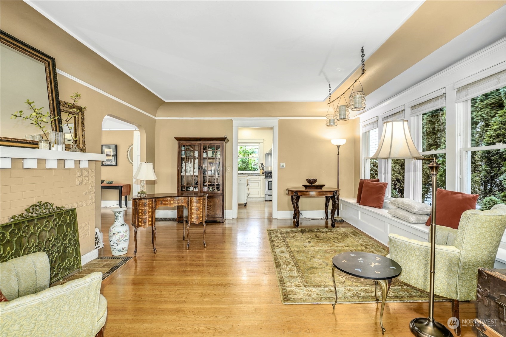 309 North 73rd Street Seattle, WA 98103 - Photo 6 of 30 a living room with fireplace furniture and floor to ceiling windows
