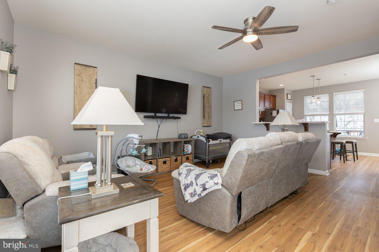 47 Landis Court Falling Waters, WV 25419 - Photo 28 of 35 a living room with furniture and a flat screen tv
