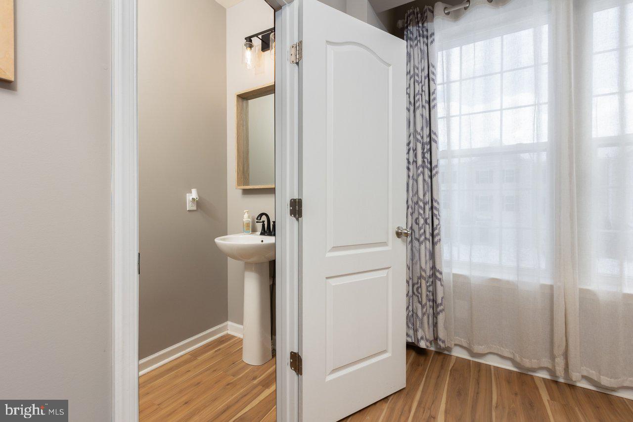 47 Landis Court Falling Waters, WV 25419 - Photo 29 of 35 a bathroom with a sink and a glass door