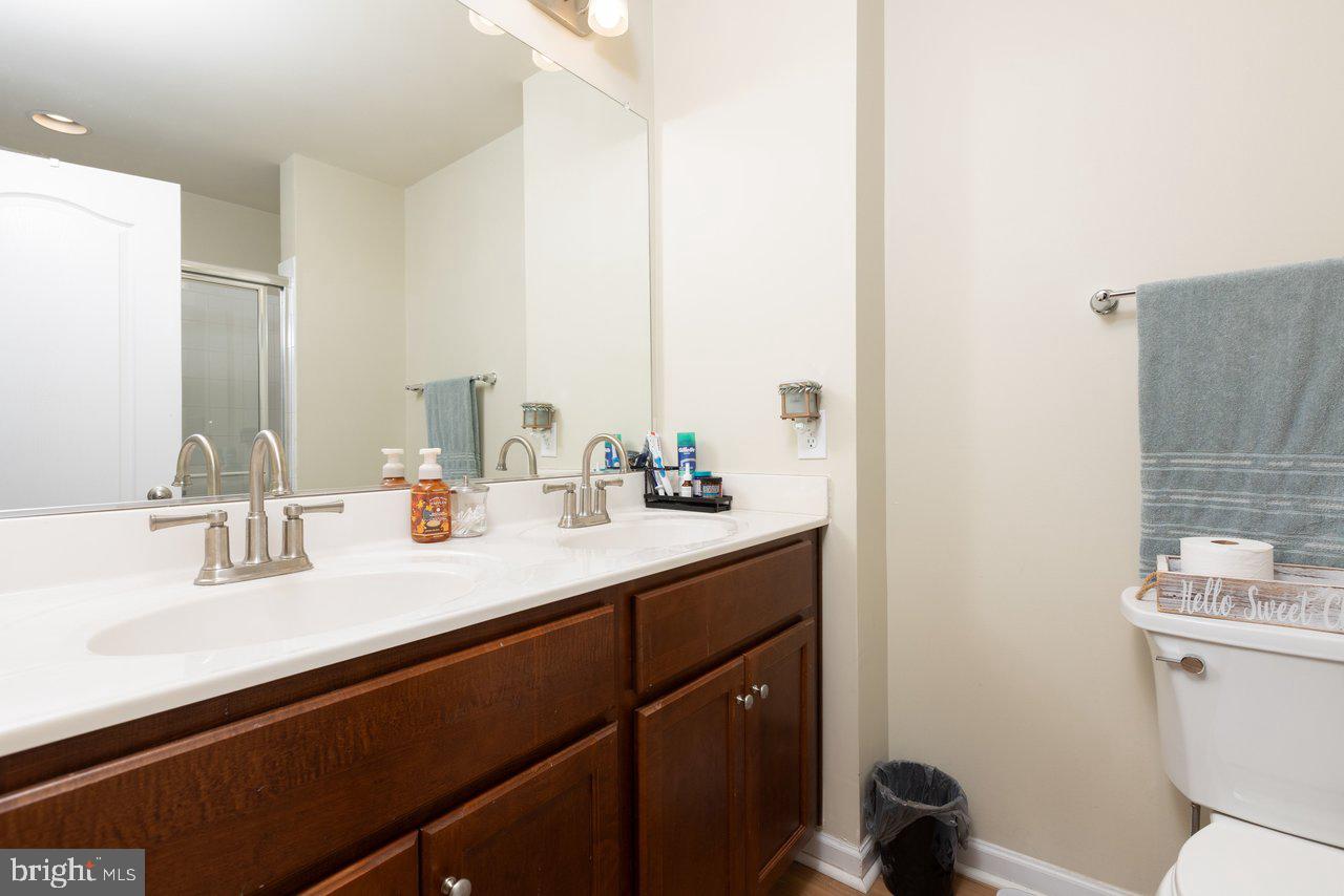 47 Landis Court Falling Waters, WV 25419 - Photo 30 of 35 a bathroom with a sink double vanity and a toilet