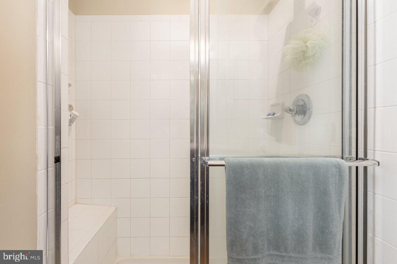 47 Landis Court Falling Waters, WV 25419 - Photo 33 of 35 a bathroom with a glass shower door