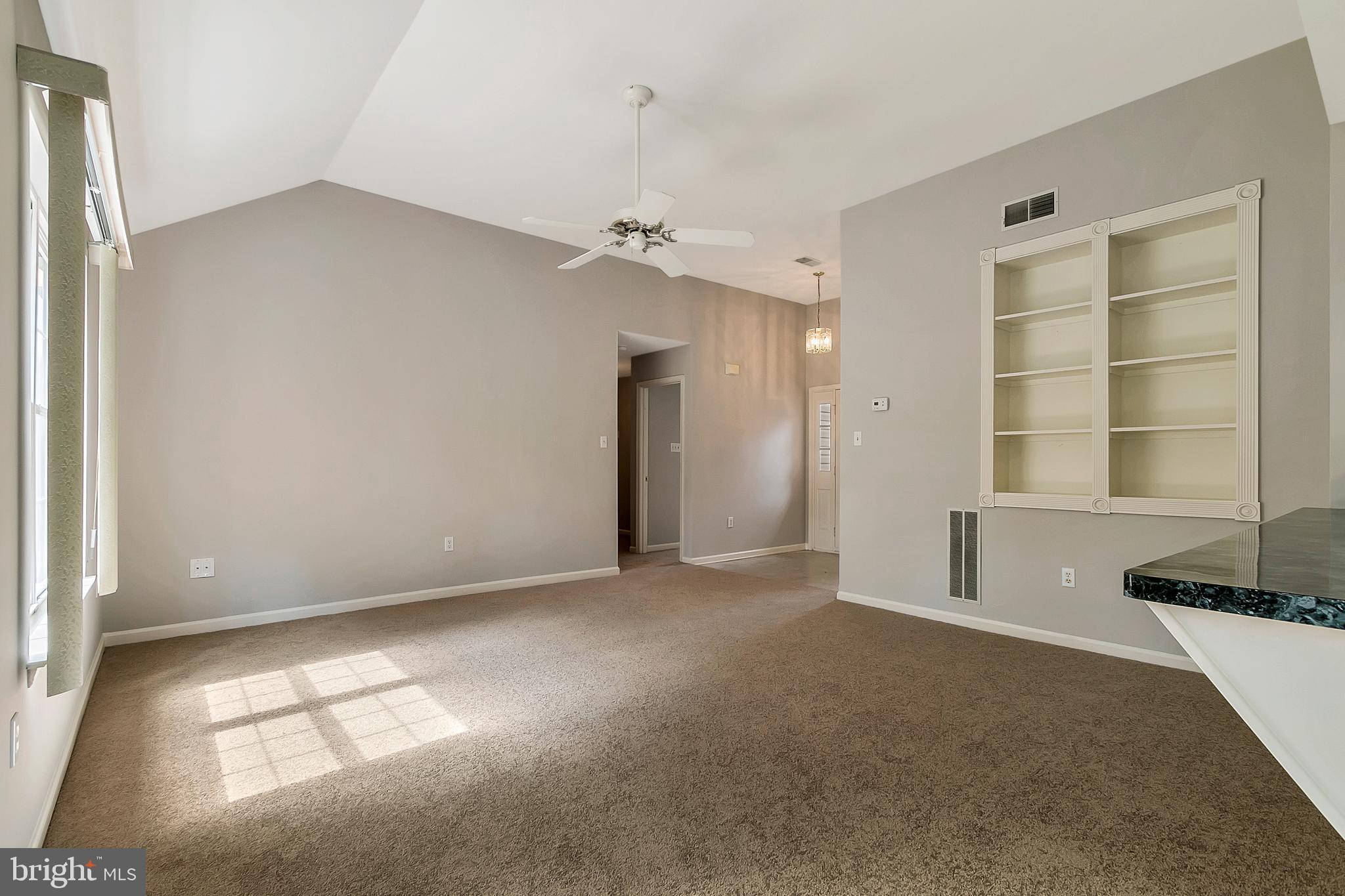 2804 Duncan Road Wilmington, DE 19808 - Photo 7 of 29 Living room with Vaulted ceiling and built-in shel