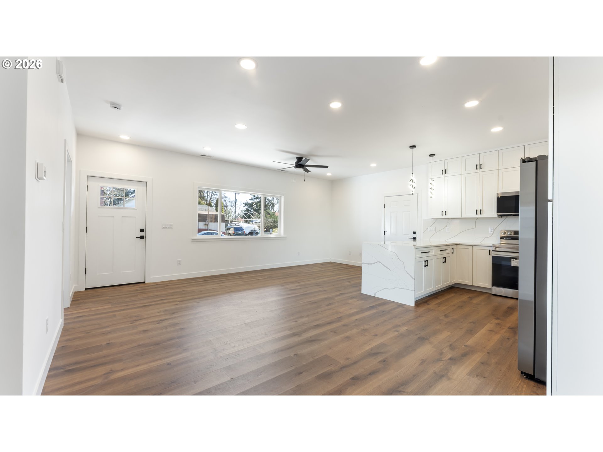 141 Northeast D Street Willamina, OR 97396 - Photo 11 of 43 a upper view of a kitchen with kitchen island a sink stainless steel appliances and cabinets