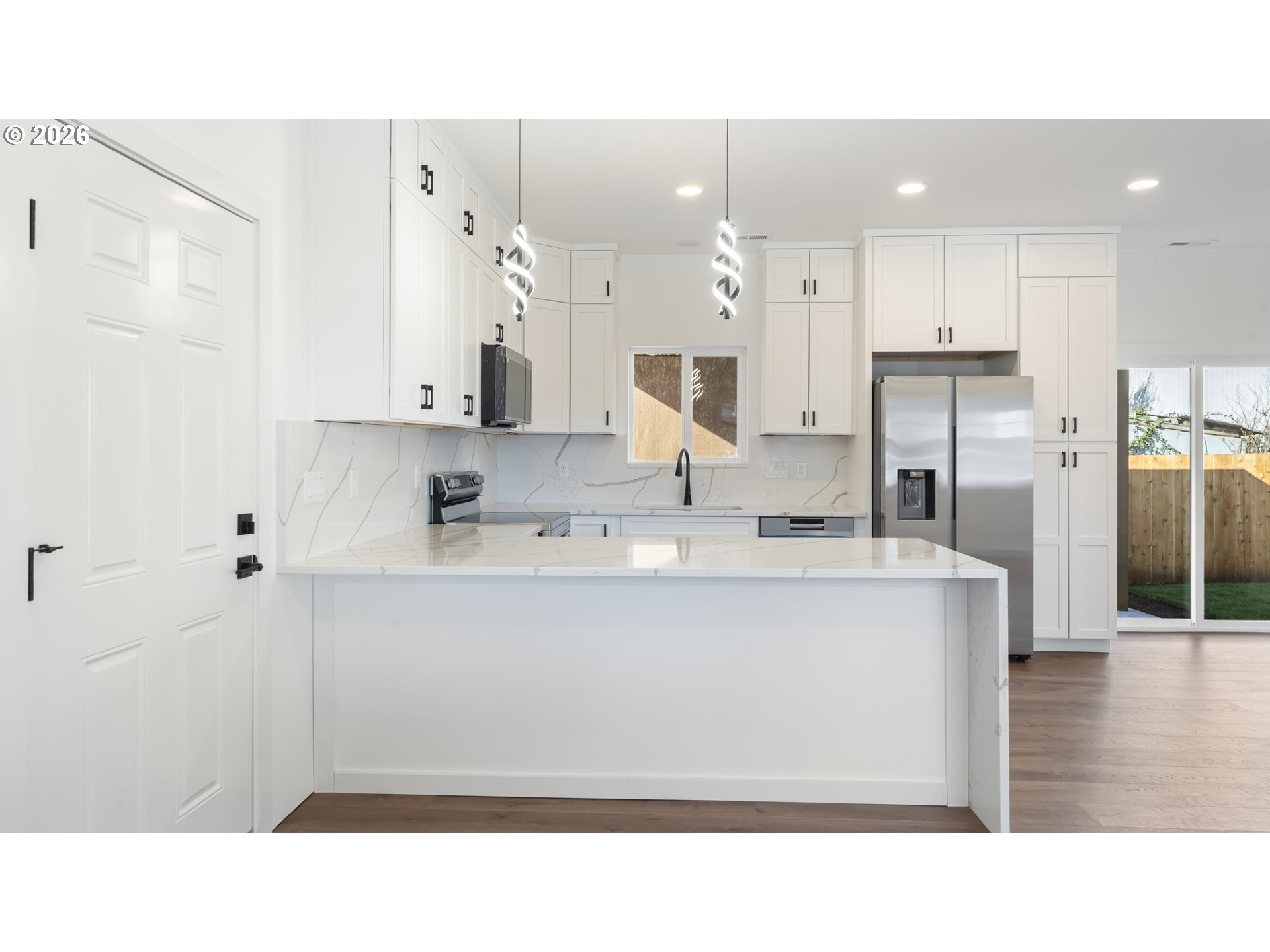 141 Northeast D Street Willamina, OR 97396 - Photo 8 of 43 a open kitchen with stainless steel appliances granite countertop a sink refrigerator and cabinets