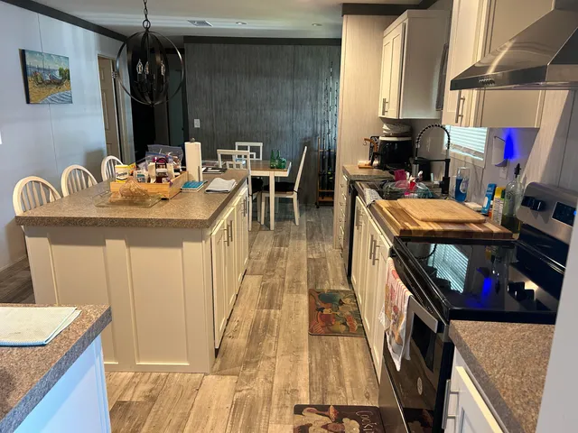 a dining room with furniture and a window