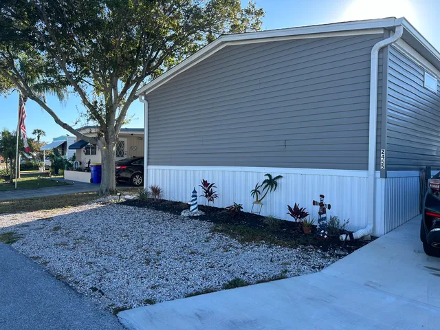 a view of a house with a backyard