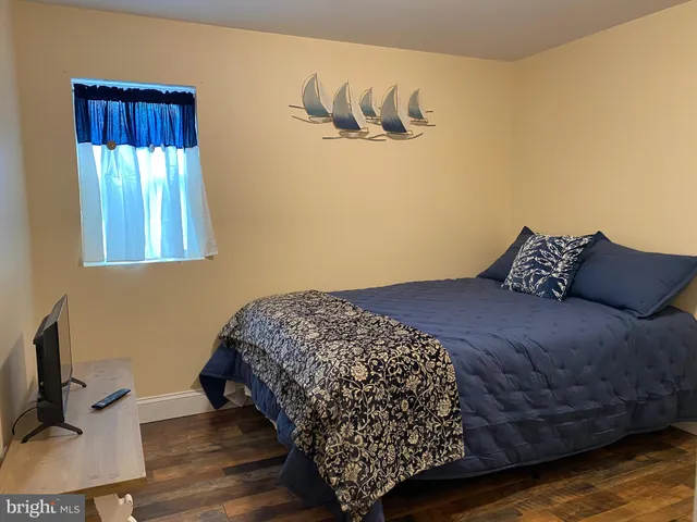 a bedroom with a bed and a table in it