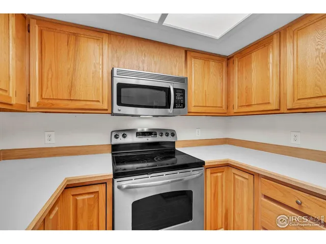a kitchen with a stove microwave and sink