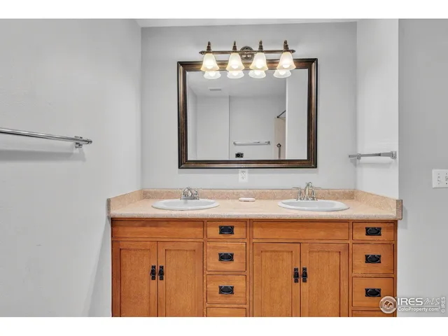 a bathroom with a sink vanity and mirror