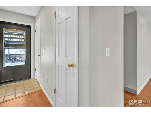 a view of an entryway with wooden floor